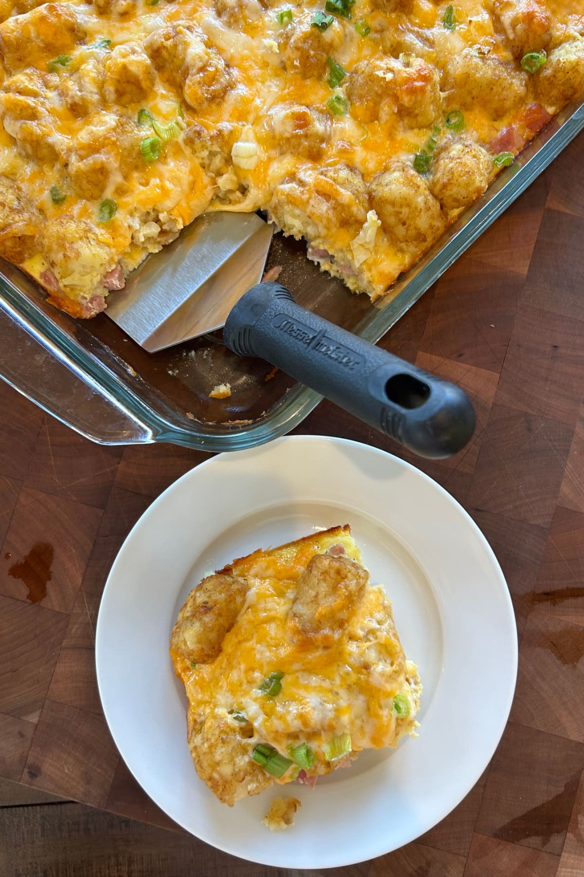 Tater Tot Breakfast Casserole recipe from RecipeGirl.com serving of tater tot breakfast casserole on plate