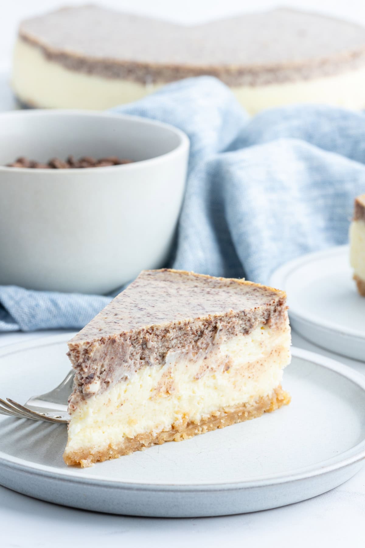 Tiramisu Cheesecake recipe from RecipeGirl.com plate of tiramisu cheesecake slice