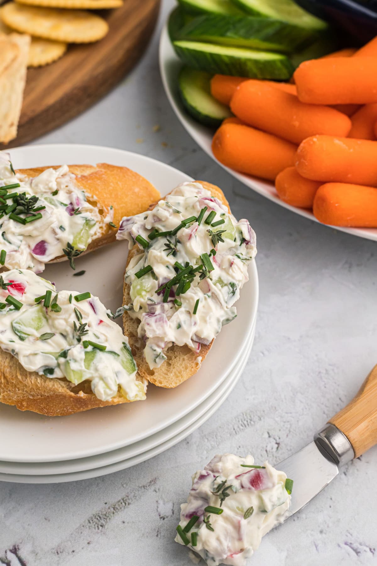 Vegetable Goat Cheese Spread recipe from RecipeGirl.com vegetable goat cheese spread on baguette slices