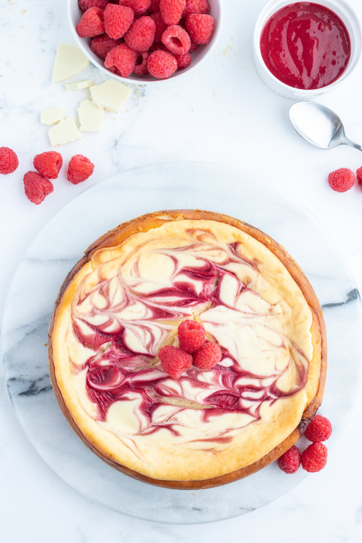 White Chocolate Raspberry Cheesecake recipe from RecipeGirl.com whole white chocolate raspberry cheesecake